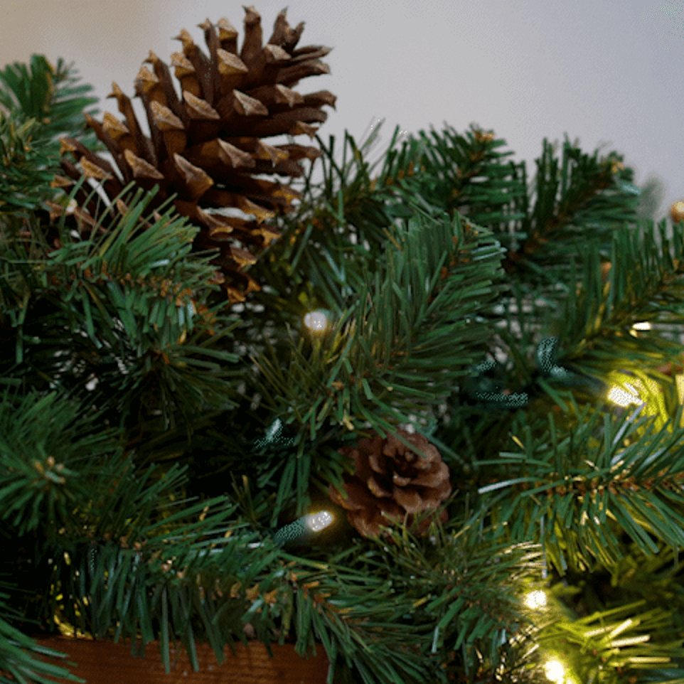 lights with garland and pinecones cozy home